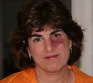 DR mugshot in orange top