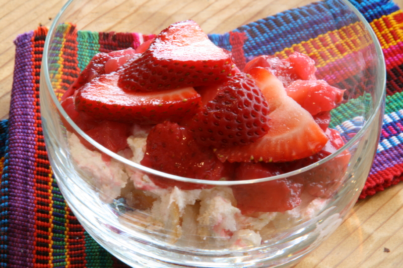 Strawberry Cloud Dessert in a glass bowl with a colorful napkin underneath