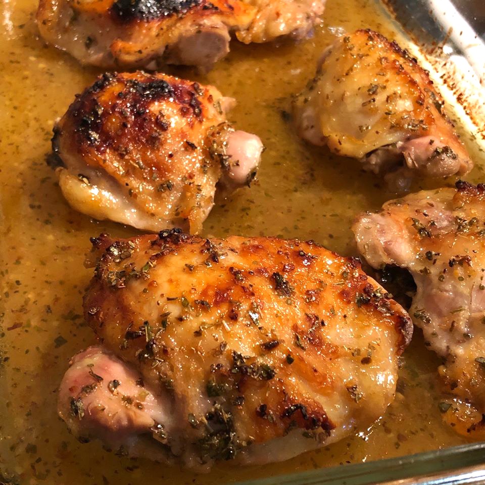 Sticky Lemon Oregano Chicken in a glass baking dish