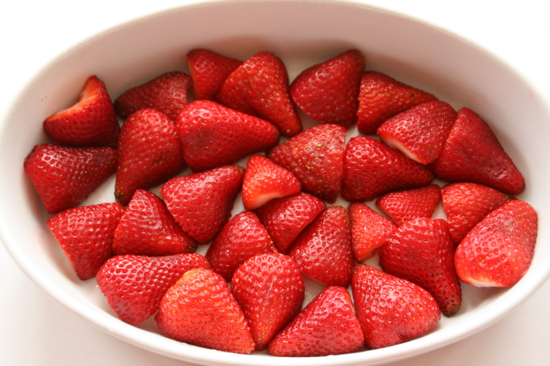 First Cover Bottom Of Baking Dish With Halved Strawberries
