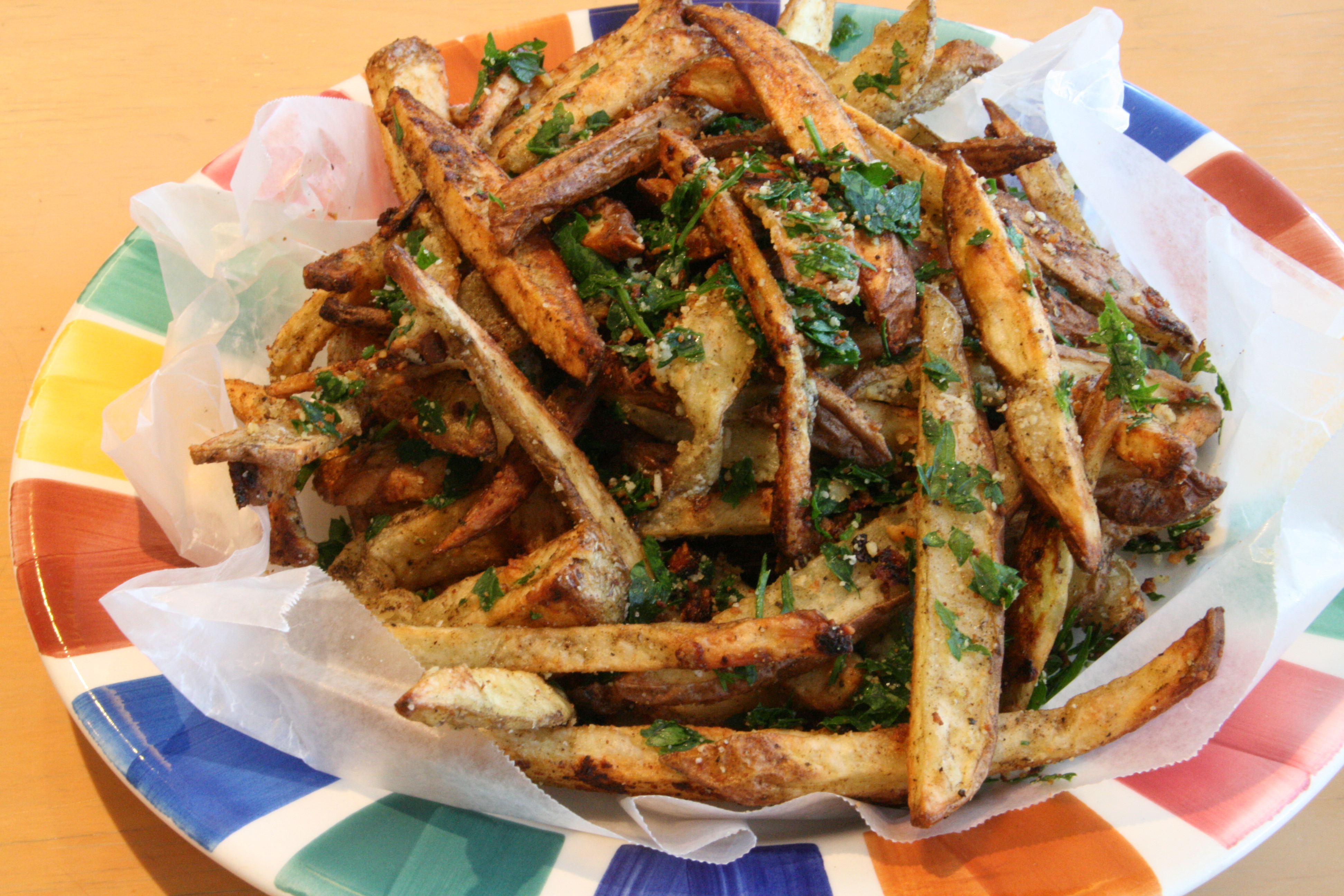 Finished pile of fries on a colorful plate