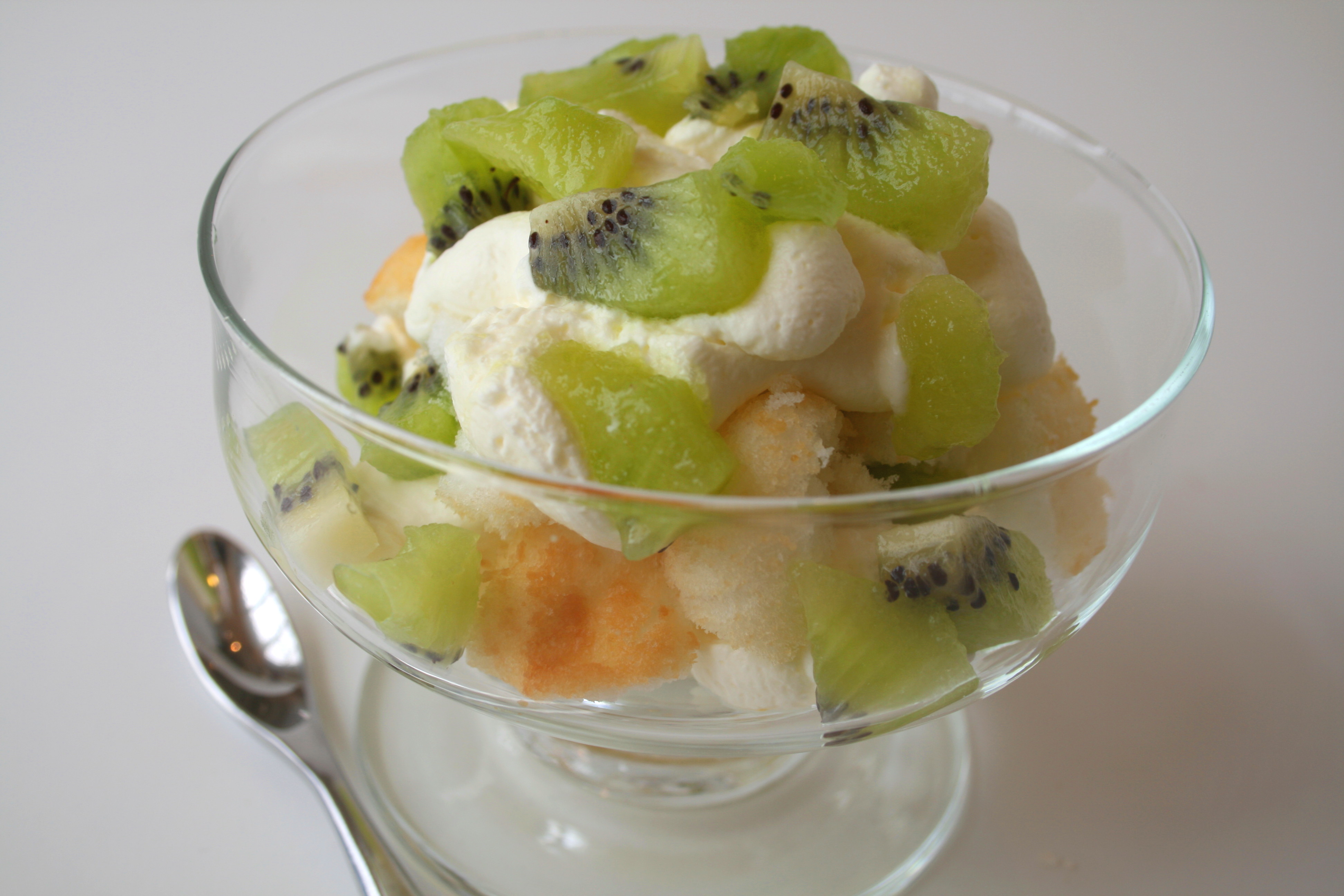 Kiwi Lemon Mousse in glass bowl on a white counter