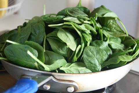 Wilting spinach in a skillet on Shockinglydelicious.com