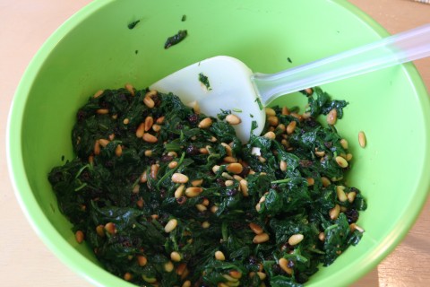 Mixing Spinach Pie with Pine Nuts and Currants on Shockinglydelicious.com