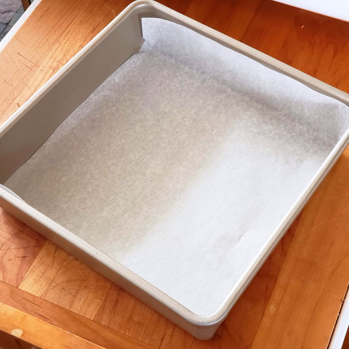 Line a 9-inch baking pan with parchment paper