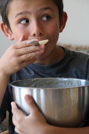 Boy eating more batter