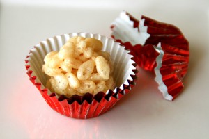 Truffled Rice Krispies Treats in red foil cup on Shockingly Delicious