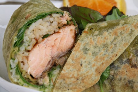 Salmon Wrap Sandwich from The Godmother Cafe of Malibu. Zippy, lemony wasabi mayonnaise on a spinach tortilla stuffed with marinated, grilled salmon, fresh spinach and healthy brown rice makes an unforgettable and gorgeous wrap for lunch or dinner!