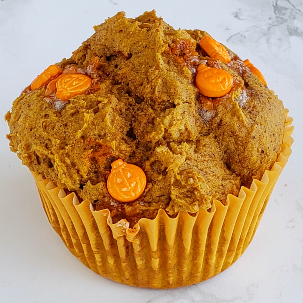 Easy Cheater Pumpkin Muffins have candy pumpkins on top