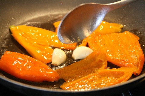 Saute peppers and garlic in a skillet