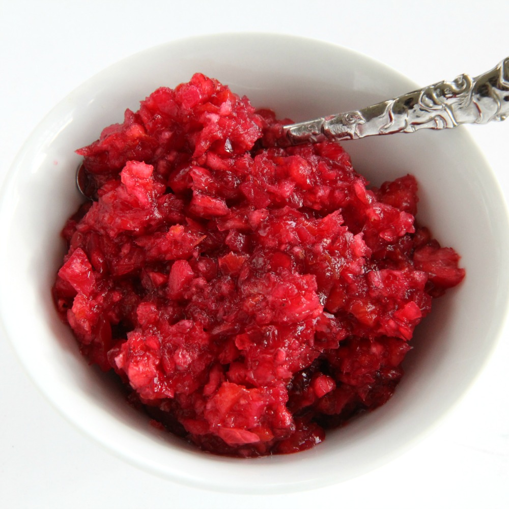 Fresh Cranberry-Ginger Relish recipe in a white bowl against a white background