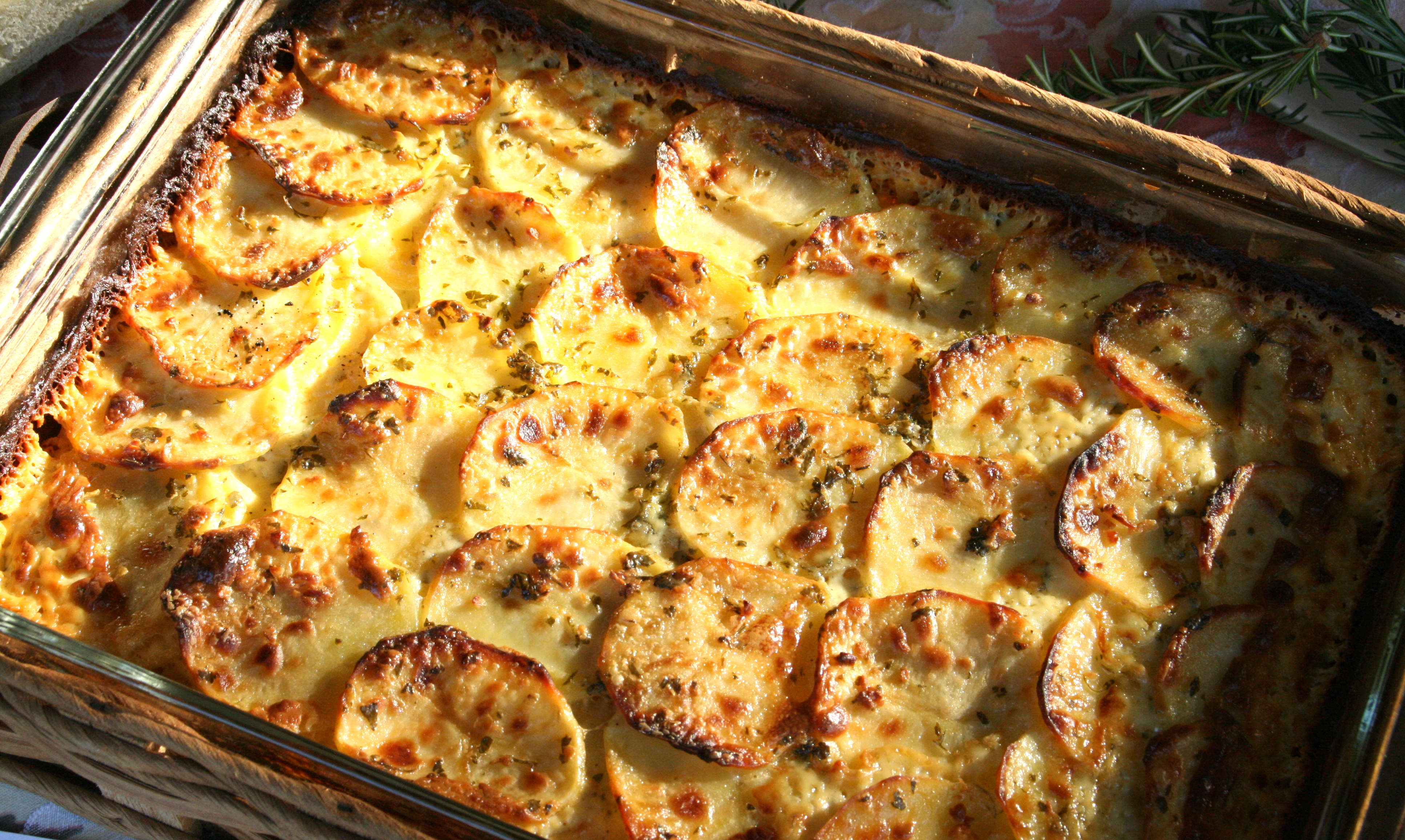 Garlic and Herb Potato Gratin layered in a casserole dish