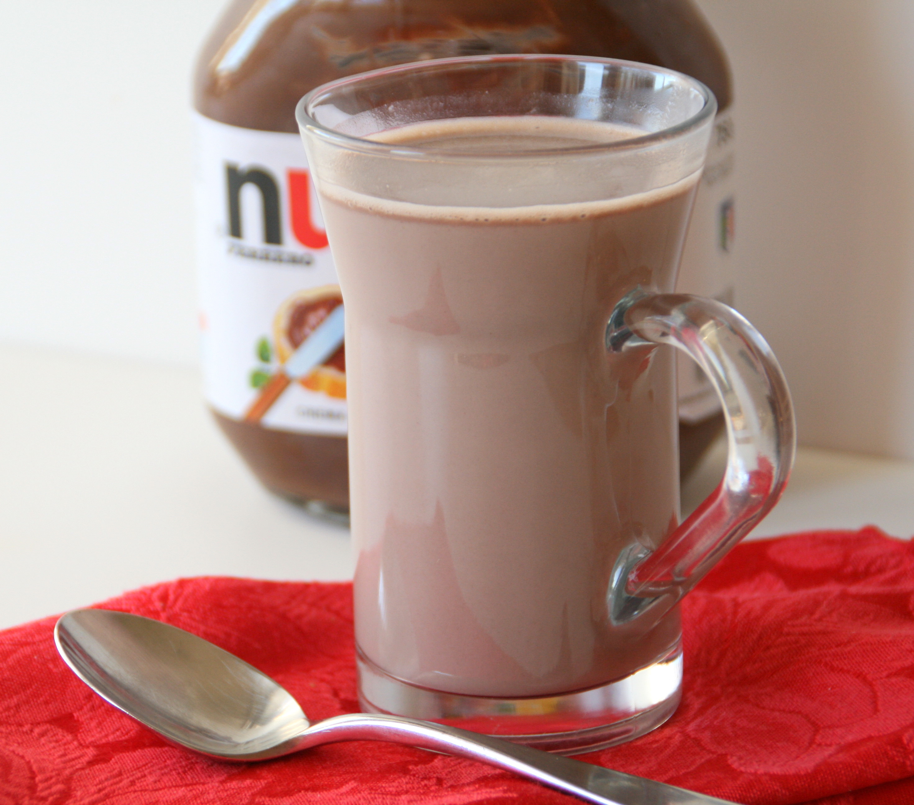 Nutella Hot Chocolate in a glass mug on a red napkin
