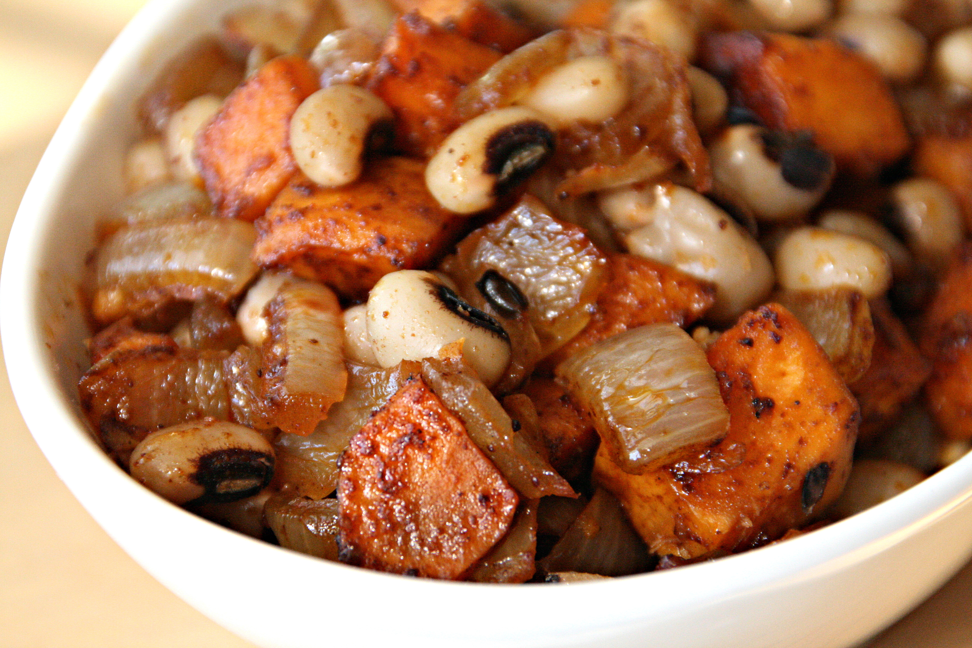 Sweet Potato, Black-Eyed Peas and onion in a white bowl