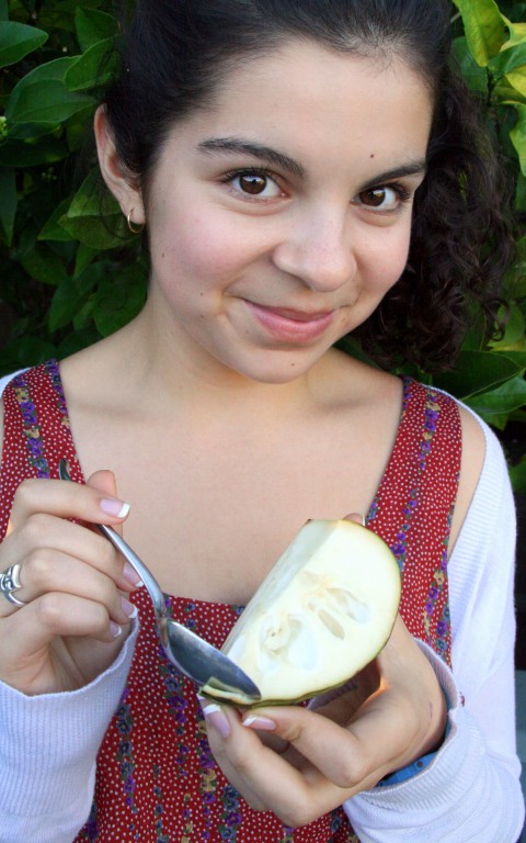 Katie eating a cherimoya