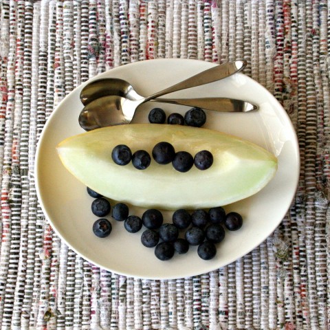 Gold Canary Melon wedge with blueberries