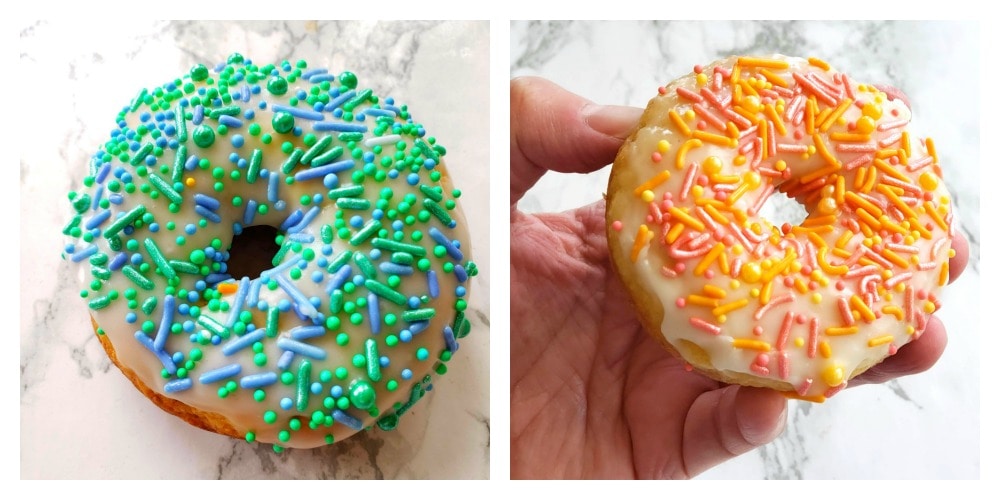 Blue donut and orange donut on a white counter