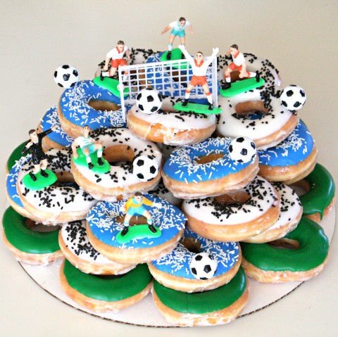 You'll have a HUGE WIN with a Donut Cake, which is simply decorated donuts arranged in stacked tiers. My son considers this Donut Soccer Cake the best cake of all time.