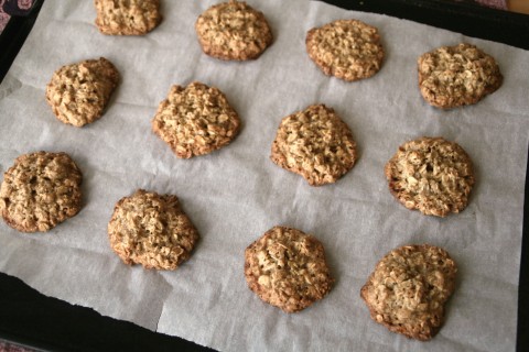 12 Flourless Caramel Oat Cookies on a white piece of parchment paper