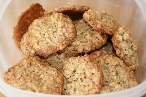 Flourless Caramel Oat Cookies piled in a plastic container