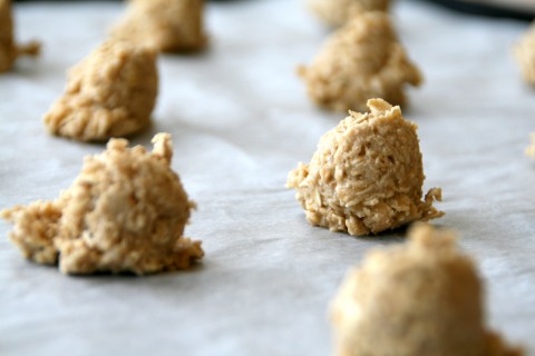 Dough from Flourless Caramel Oat Cookies plopped onto parchment paper