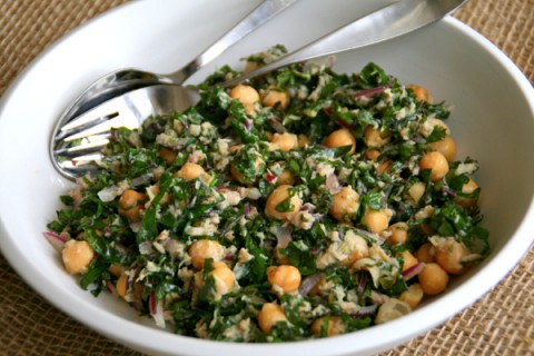 Kale Salad in a white bowl on burlap