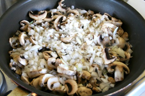 Onions and mushrooms in the skillet on ShockinglyDelicious.com