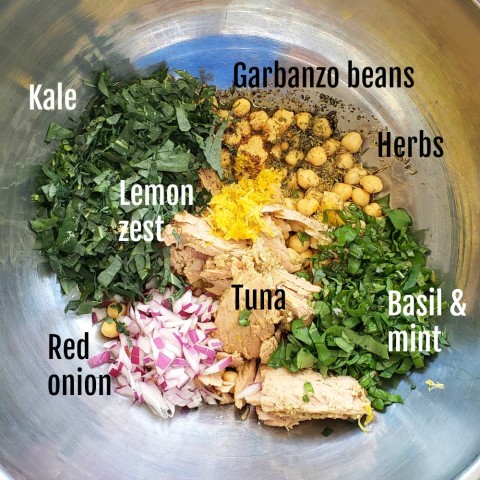 Ingredients in bowl for Lemony Garbanzo Kale Salad with Tuna on ShockinglyDelicious.com