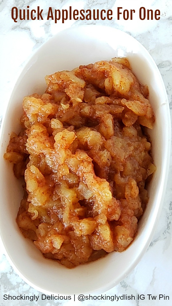 Quick Applesauce for One in a white bowl on a white marble counter on ShockinglyDelicious.com