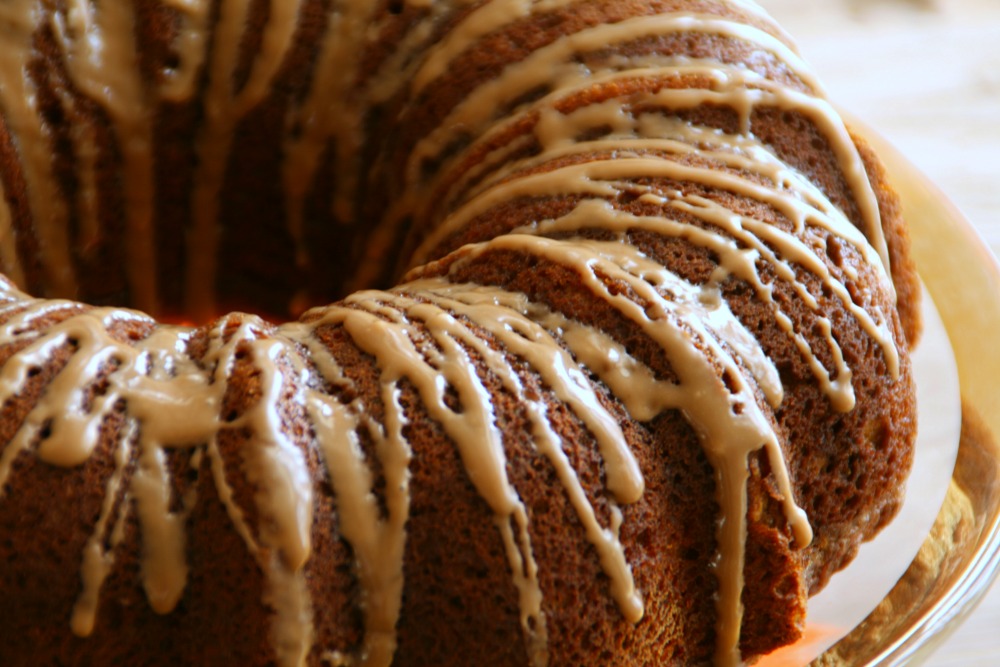 Spiced Pumpkin-Pecan Bundt Cake with Maple Glaze showing the top of the cake