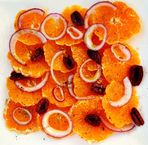 Sweet oranges or tangerines, sharp onions, salty olives and zippy black pepper combine in a traditional Italian Orange Salad for Christmas Eve or any winter dinner. | ShockinglyDelicious.com