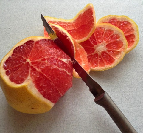 Grapefruit cutting into supremes on Shockingly Delicious