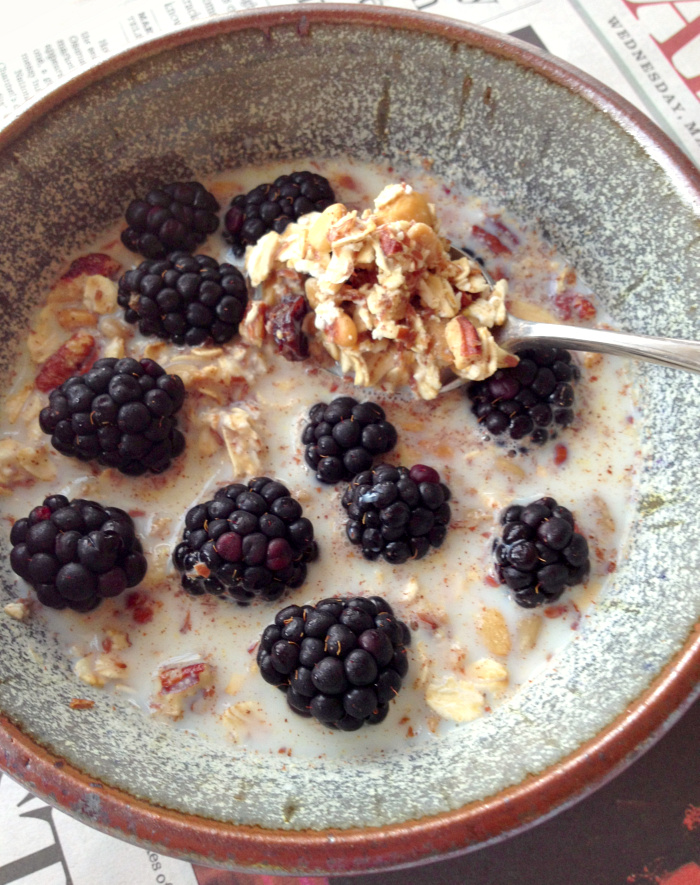 Homemade Nutty Oat Cold Cereal in a bowl on newspaper 