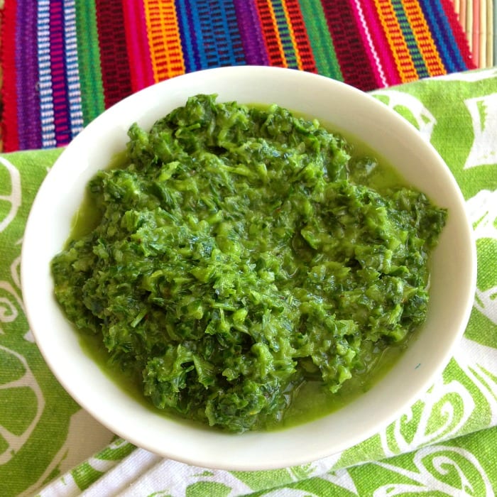 Classic 5-Minute Chimichurri Sauce in a round white bowl on a colorful background 