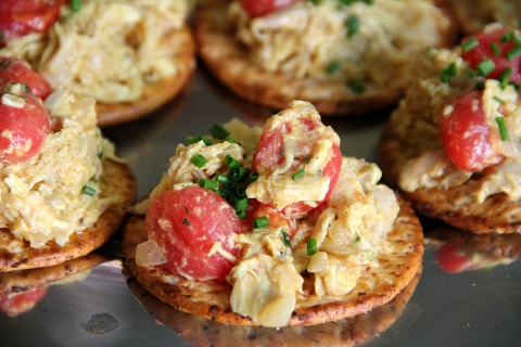Coronation Turkey -- a lightly curried turkey salad topped with fresh cherry tomatoes makes a wonderful lunch or dinner salad, or a cracker-topper for an appetizer.