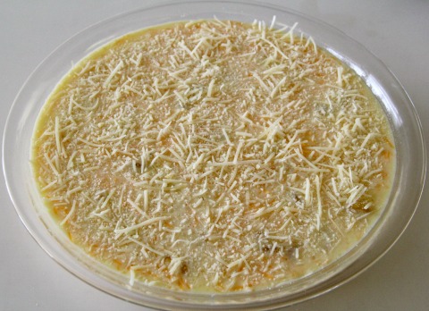 A final sprinkling of shredded Parmesan goes on top before baking | www.ShockinglyDelicious.com