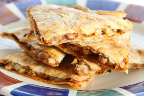 Black-eyed Pea Quesadillas: Earthy black-eyed peas join with aged cheddar and warm spices in a New Year’s Day quesadilla designed to capture good luck for the coming year.