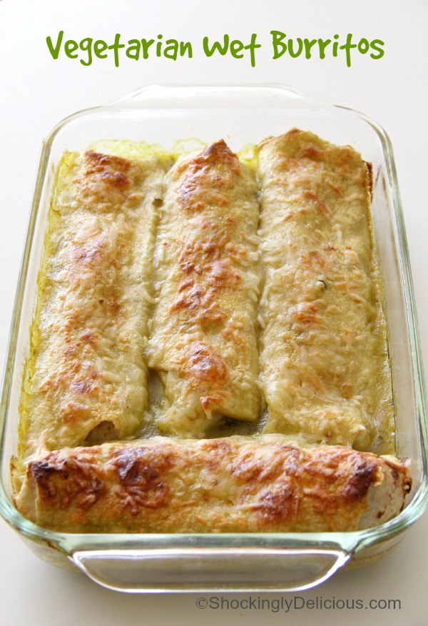 Vegetarian Wet Burritos are a simple grains mix and beans enlivened with Mexican spices, wrapped in a tortilla and smothered in green enchilada sauce. Eat with a knife and fork. Great for an easy weeknight meal. #shockinglydelicious #Mexicanrecipe #burritorecipe #vegetarianMexican 4 Vegetarian Wet Burritos in a glass baking dish on ShockinglyDelicious.com