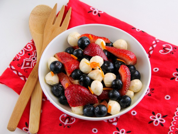 Red, White and Blue Fruit and Cheese Salad in a white bowl on a red bandana