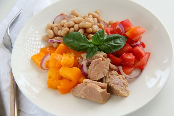 Tuna, Tomato, Bean and Basil Salad arranged in a white bowl | ShockinglyDelicious.com