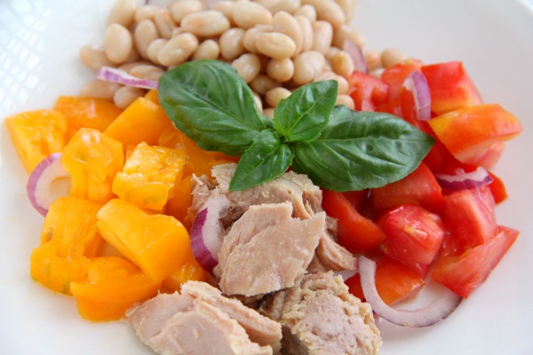 Tuna, Tomato, Bean and Basil Salad in a white bowl on ShockinglyDelicious.com