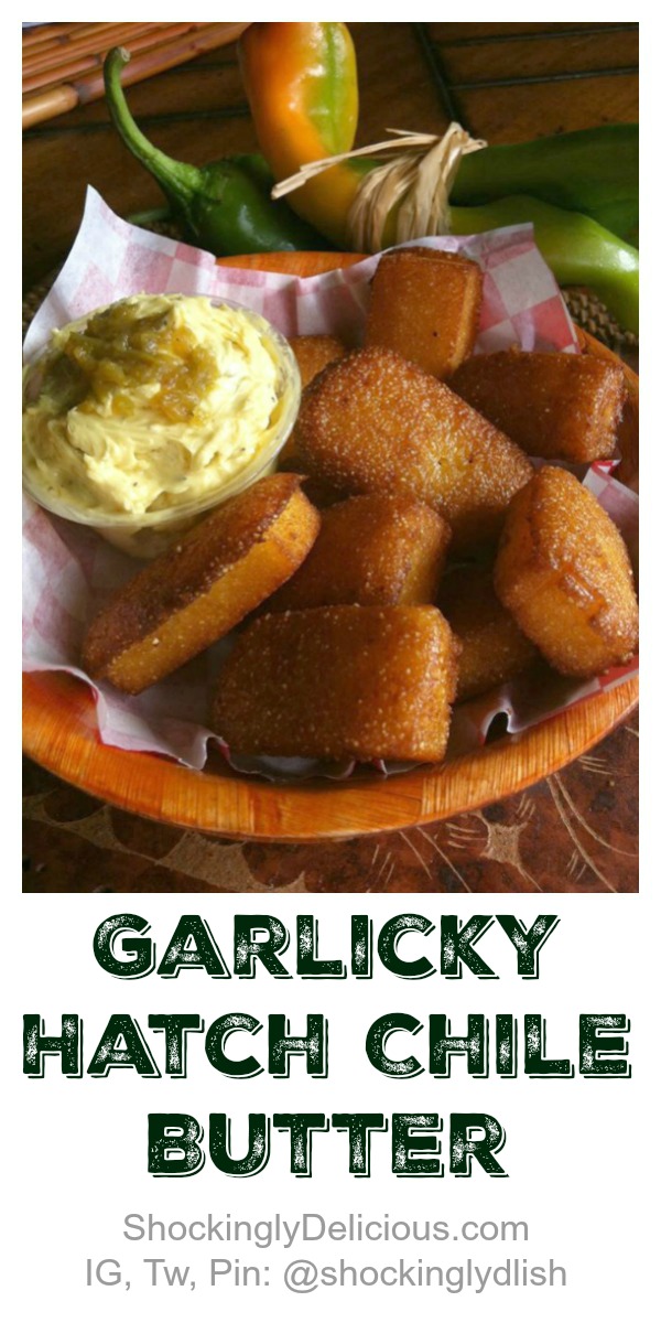 Garlicky Hatch Chile Butter in a ramekin along with cornbread in a basket on ShockinglyDelicious.com