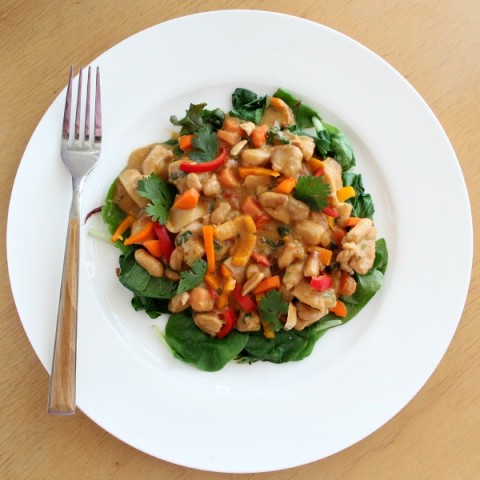 Creamy Peanut Chicken Over Greens |ShockinglyDelicious.com