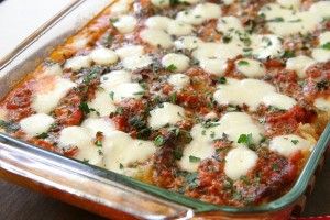 Spaghetti Squash Casserole dotted with fresh mozzarella in a glass baking dishom