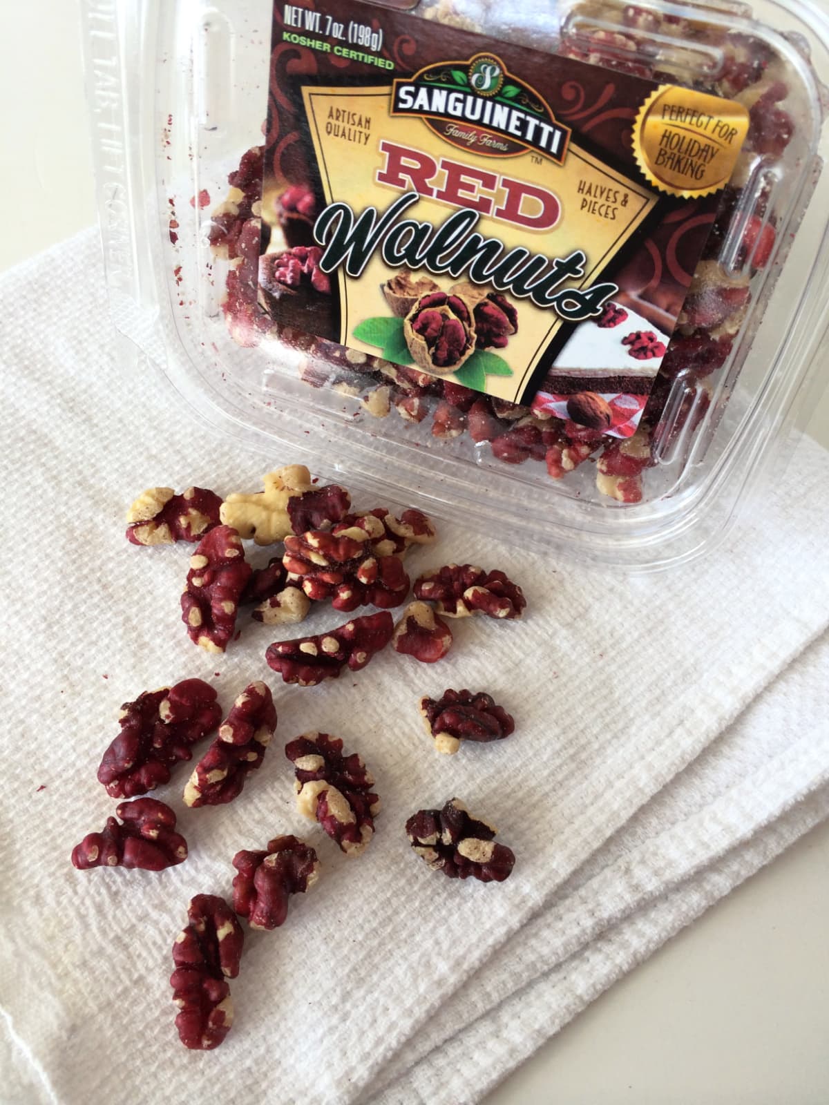 Red Walnuts on a white dishcloth