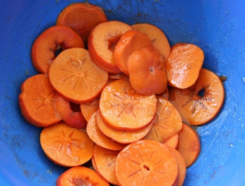 Persimmon Tart cut persimmons in a bowl on ShockinglyDelicious