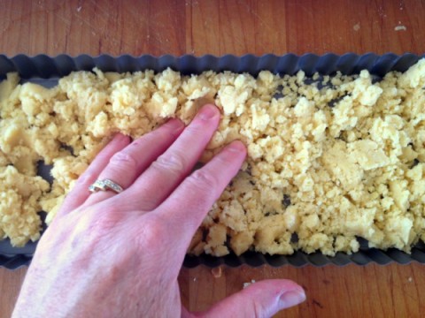 Pressing in crust for Persimmon Tart on ShockinglyDelicious.com