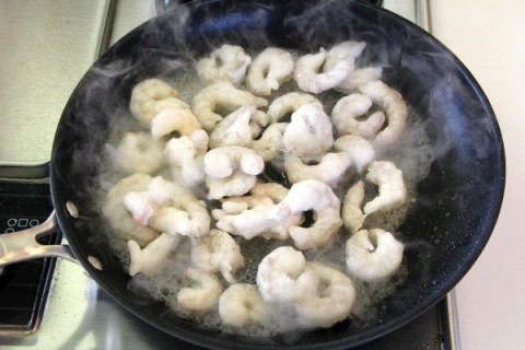 Frozen shrimp in the skillet for 2-Ingredient Red Chile Shrimp