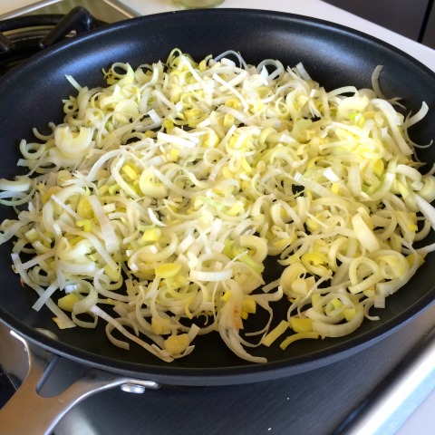 Chopped leeks in a skillet for Frittata Bites