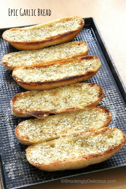 Toasted Garlic Bread Rolls laid out on a cookie sheet for National Garlic Day on ShockinglyDelicious.com